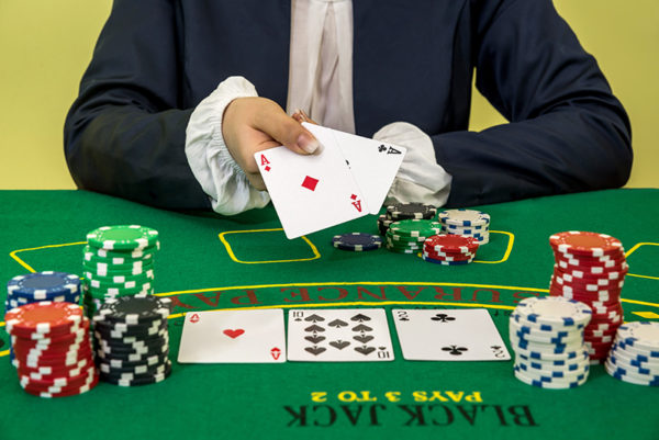 Woman play black jack in casino, gambling; Shutterstock ID 1077051215; Project: -